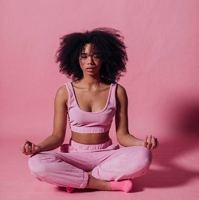 Woman in pink meditating